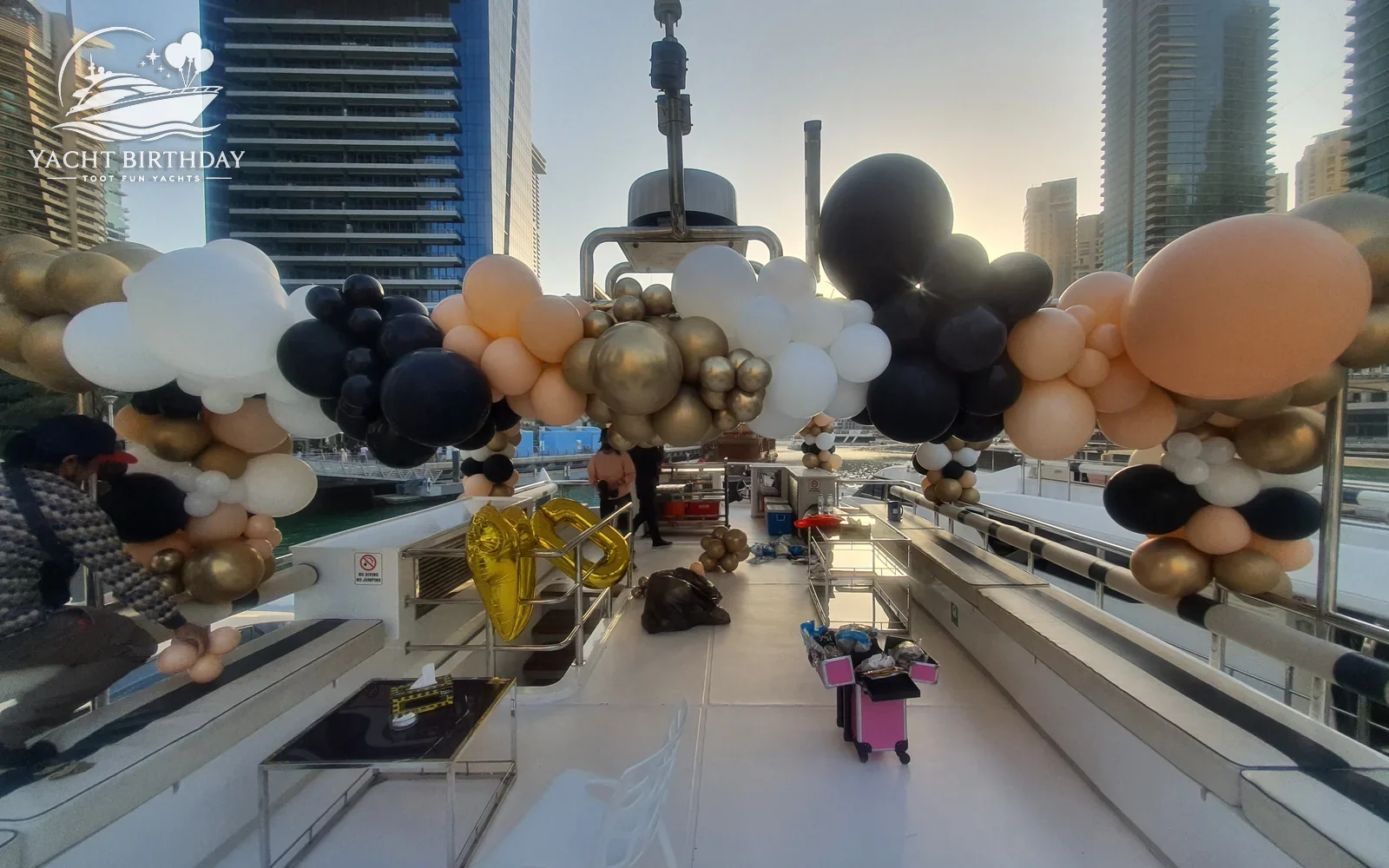 Gold black balloon garland yacht deck