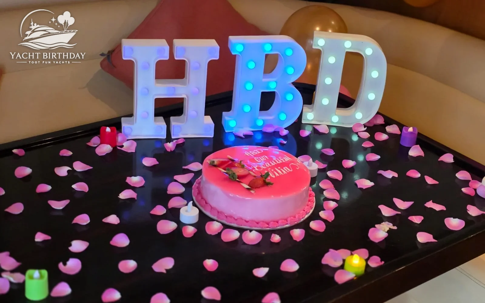 Hbd light letters cake yacht