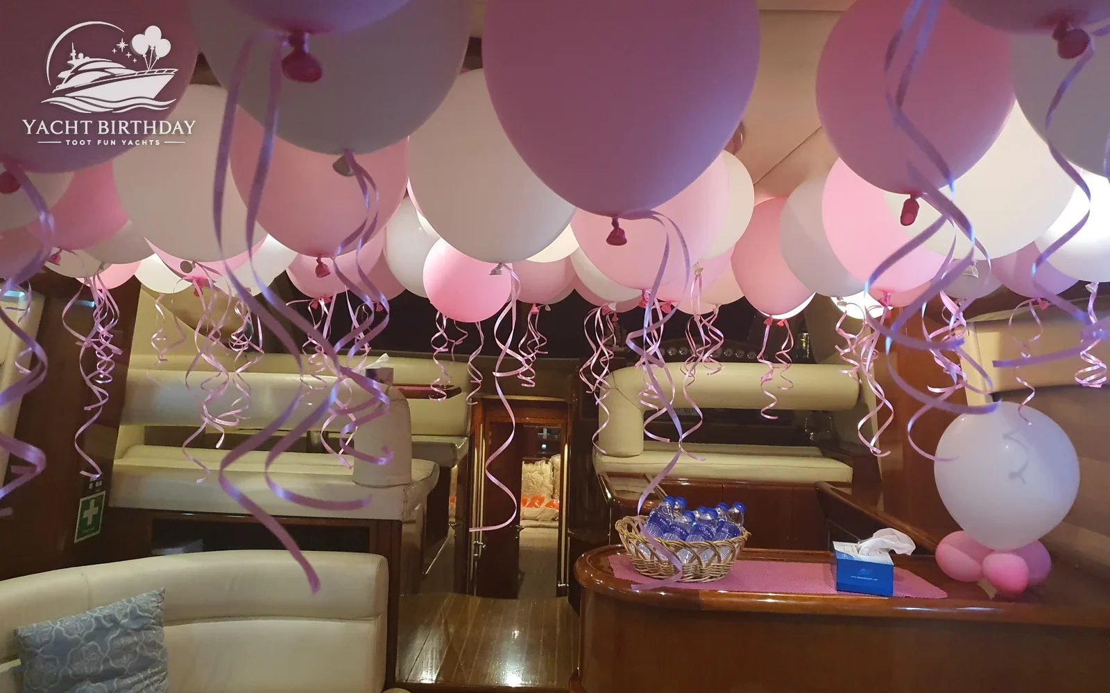 Pink balloon ceiling birthday yacht