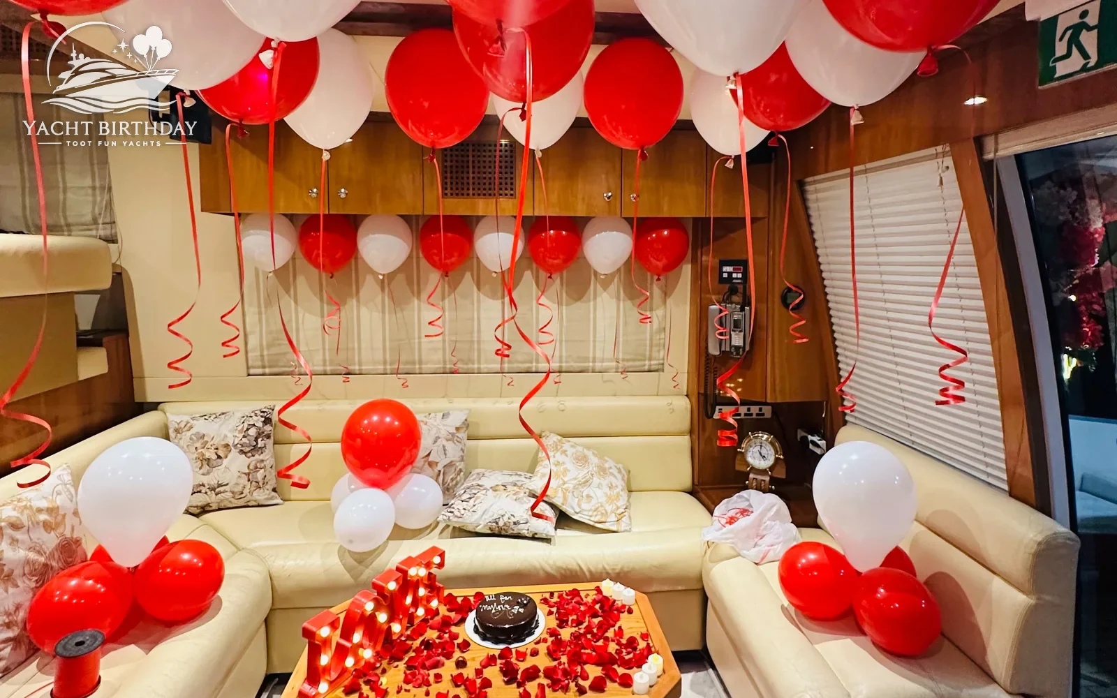 Red white balloons rose petals yacht