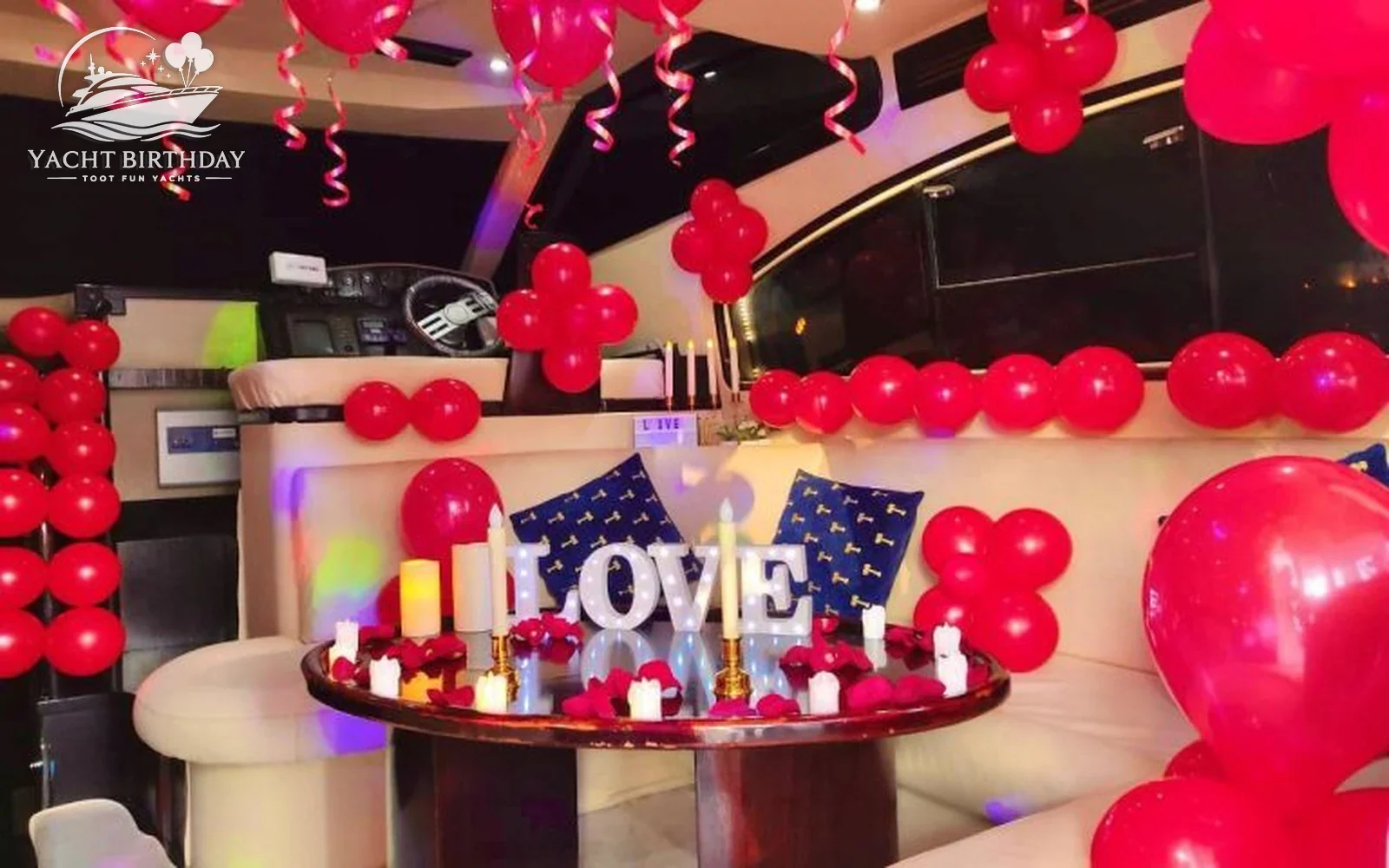 Romantic setup candles red balloons yacht